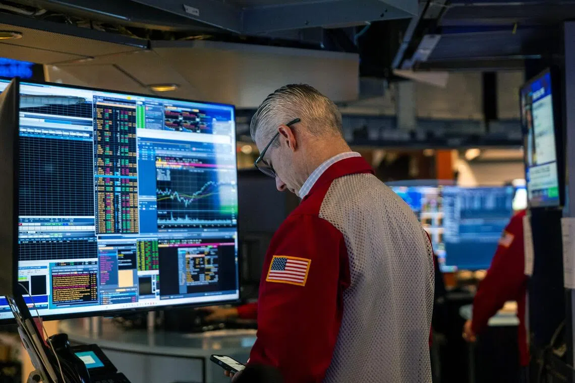 Traders working on the floor of the New York Stock Exchange, in New York City, on Nov 18. 