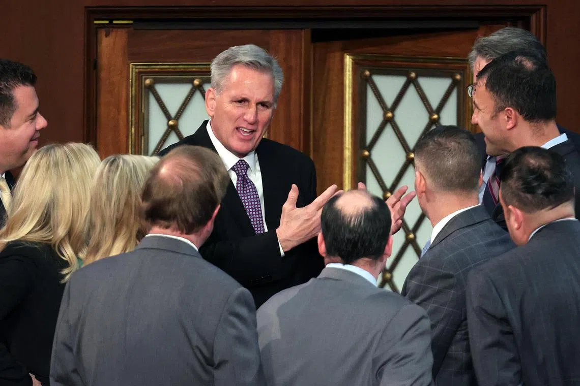 WASHINGTON, DC - JANUARY 04: U.S. House Republican Leader Kevin McCarthy (R-CA) talks to members-elect in the House Chamber during the second day of elections for Speaker of the House at the U.S. Capitol Building on January 04, 2023 in Washington, DC. The House of Representatives is meeting to vote for the next Speaker after House Republican Leader Kevin McCarthy (R-CA) failed to earn more than 218 votes on three separate Tuesday ballots, the first time in 100 years that the Speaker was not elected on the first ballot.   Win McNamee/Getty Images/AFP (Photo by WIN MCNAMEE / GETTY IMAGES NORTH AMERICA / Getty Images via AFP)