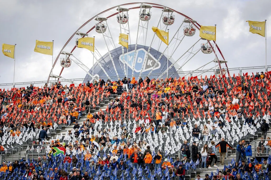 Spectators in the stands ahead of the Formula One Dutch Grand Prix at the Circuit Zandvoort racetrack in the Netherlands, on Aug 23.