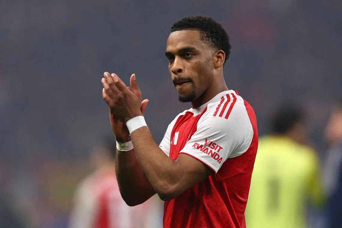 FILE PHOTO: Soccer Football - UEFA Champions League - Round 16 - First Leg - Bayer Leverkusen v Arsenal - BayArena, Leverkusen, Germany - March 11, 2026 Arsenal's Jurrien Timber applauds fans after the match REUTERS/Wolfgang Rattay/File Photo