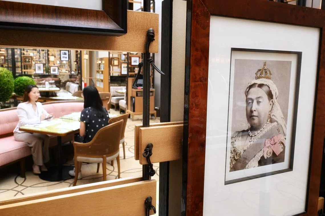 The walls of buffet restaurant, Colony, at the Ritz-Carlton, Millenia Singapore are adorned with portraits of British Queen Victoria and other imperial imagery. 