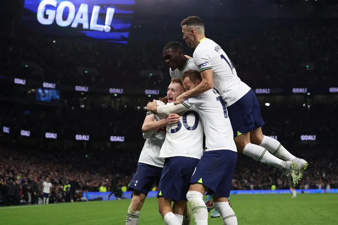 Tottenham Hotspur's Rodrigo Bentancur celebrates scoring their fourth goal with teammates.