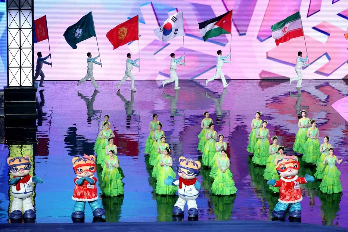 Performers participate beside mascots Binbin and Nini in the closing ceremony of Harbin 2025 Asian Winter Games.