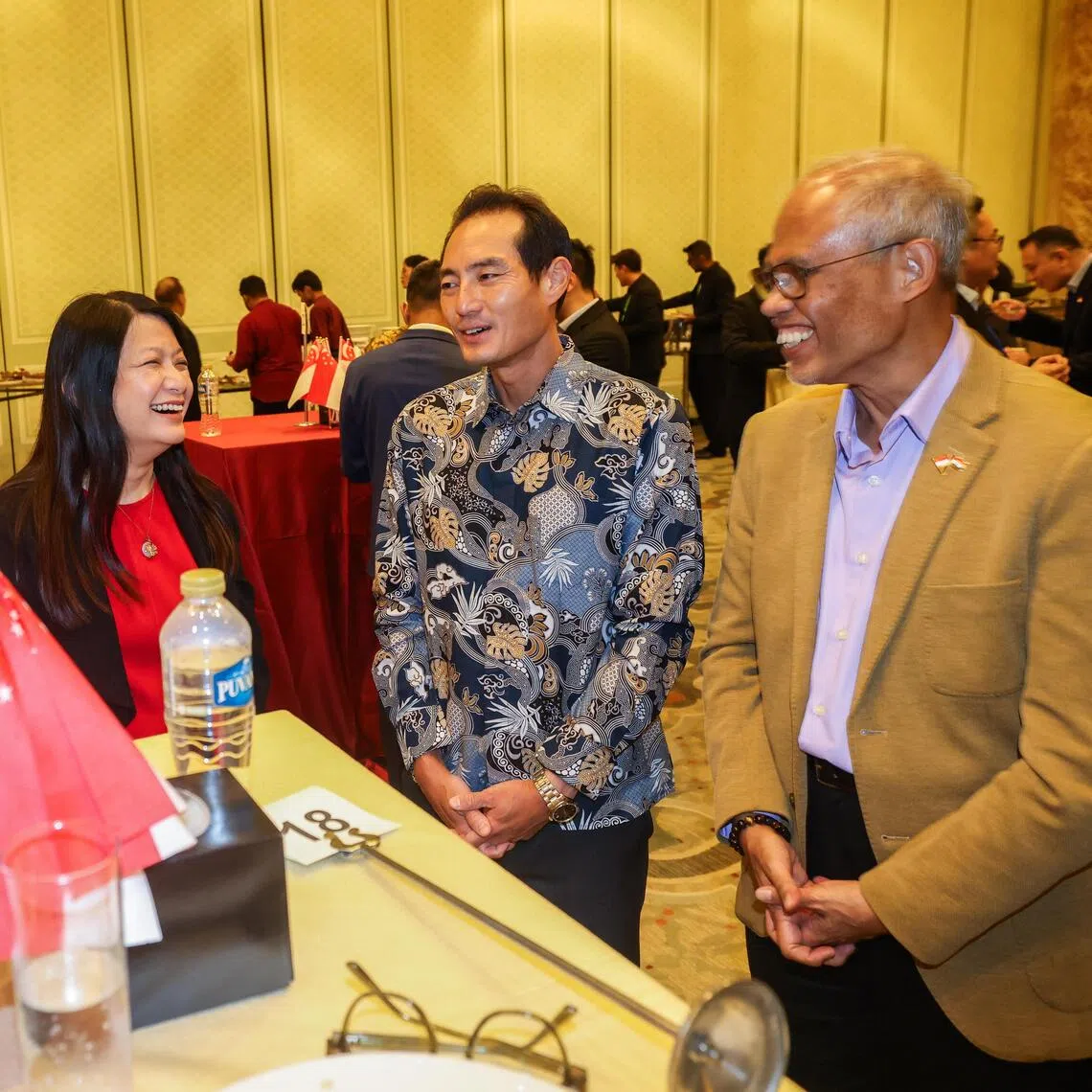 (From right) Minister for Social and Family Development Masagos Zulkifli and Senior Minister of State for Health Tan Kiat How speaking to paediatrician Joyce Lam Ching Mei and nurse manager Noor Haziah Hussain at an SG60 reception in Cairo on Sept 19.