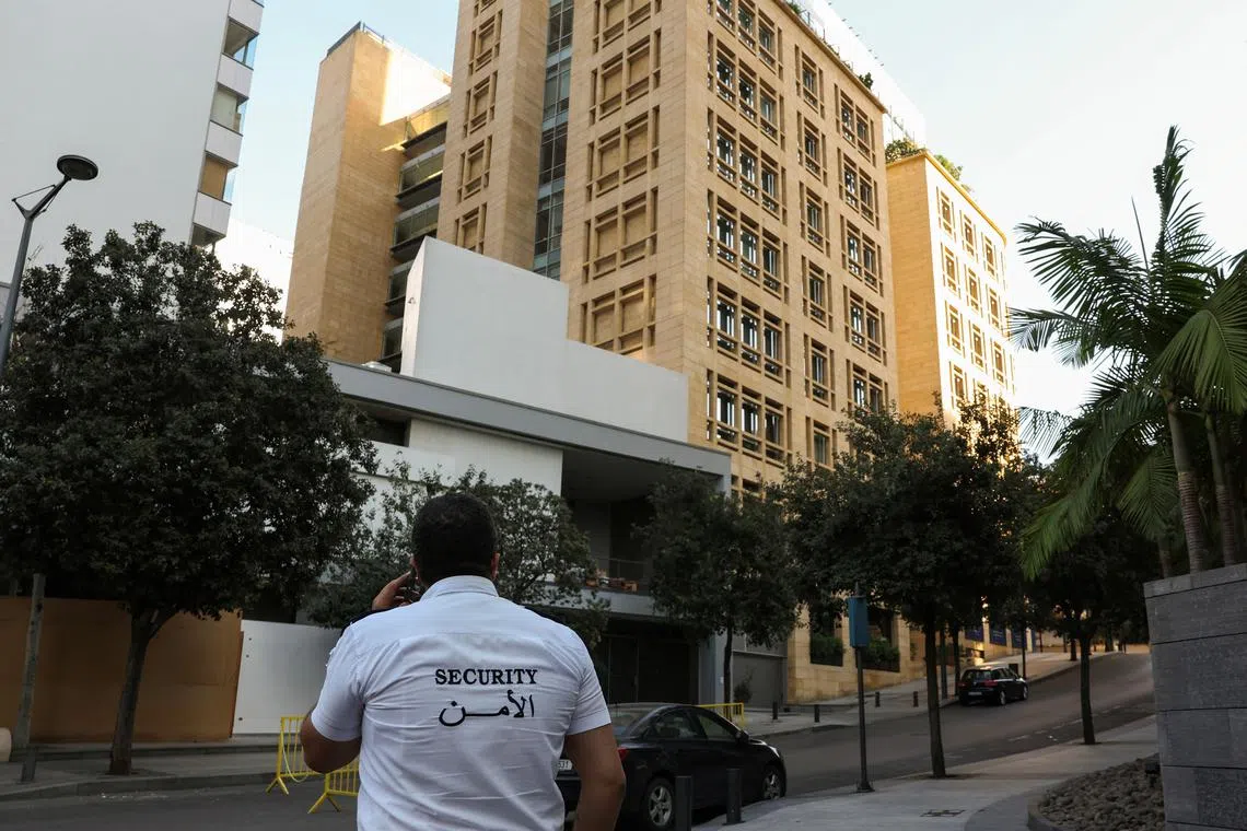 A security guard stands near a building that includes the offices of Qatar's Al-Jazeera TV and the Norwegian embassy, in Lebanon.