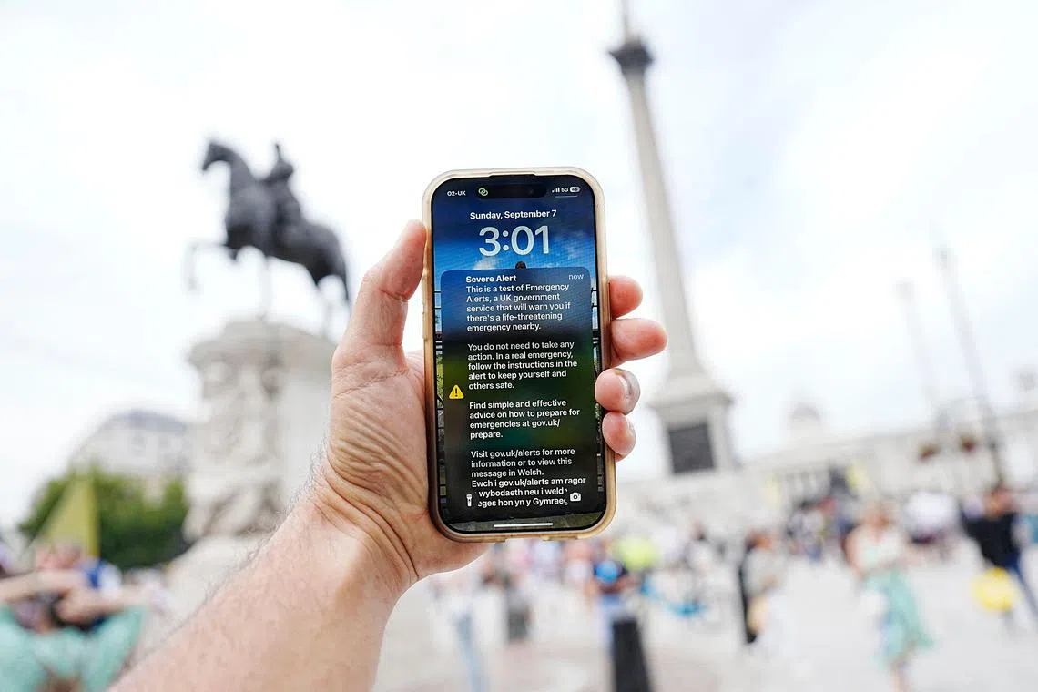 An Emergency Alert is pictured on the screen of a smartphone in central London on Sept 7.