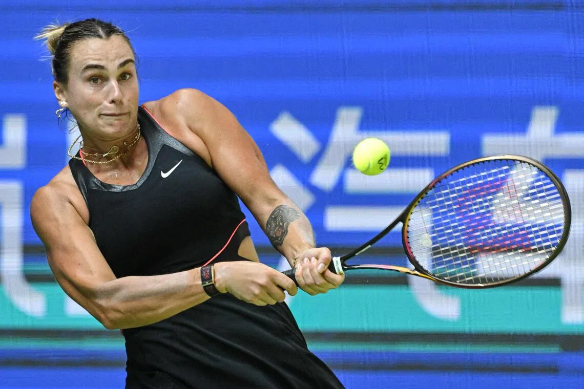 Belarus’ Aryna Sabalenka hits a return to Kazakhstan's Elena Rybakina during their women’s singles quarter-final match at the Wuhan Open.