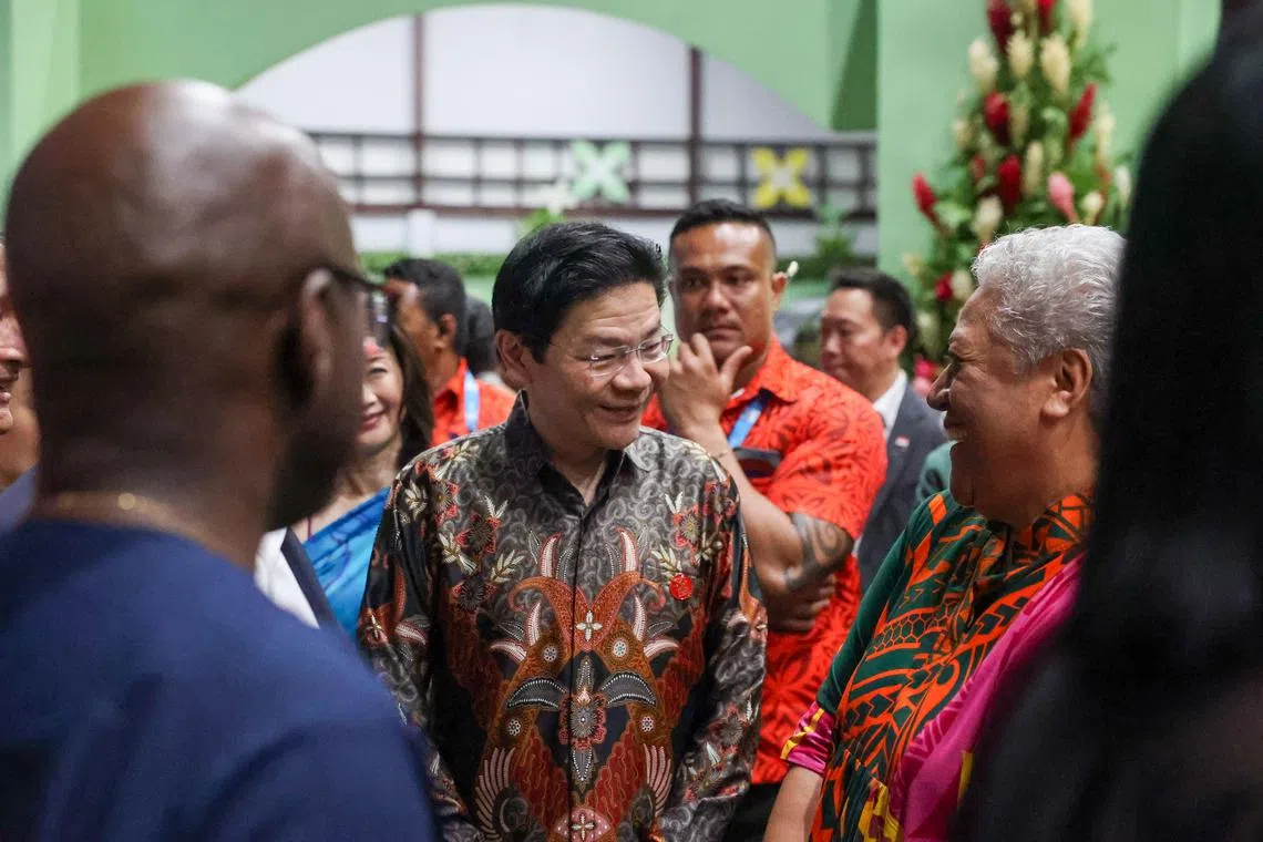 PM Lawrence Wong with PM of Samoa, Fiamē Naomi Mataʻafa (right), at the official welcome reception and state banquet during Chogm on Oct 24.