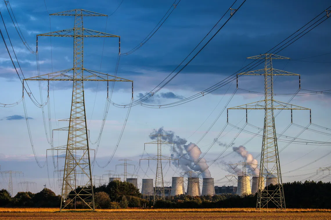 Power lines are seen in front of the Janschwalde power plant in Turnow-Preilack, Germany.