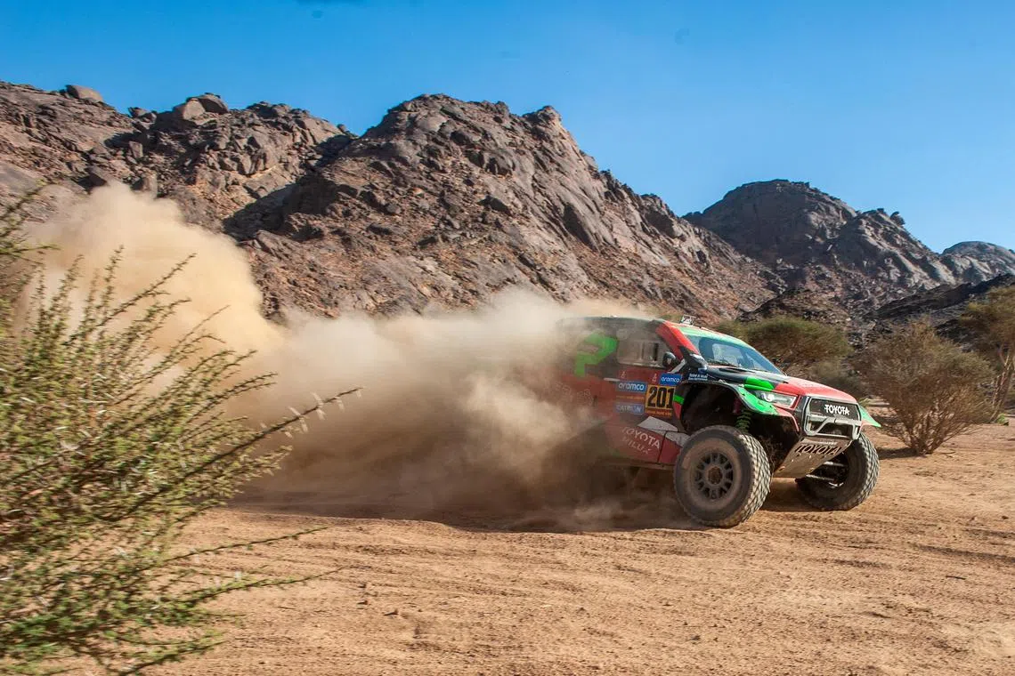 Saudi driver Yazeed Al-Rajhi and German co-driver Timo Gottschalk driving their Toyota Hilux Overdrive for Overdrive Racing during the first stage of the 2025 Dakar Rally, in Bisha, Saudi Arabia on Jan 4.