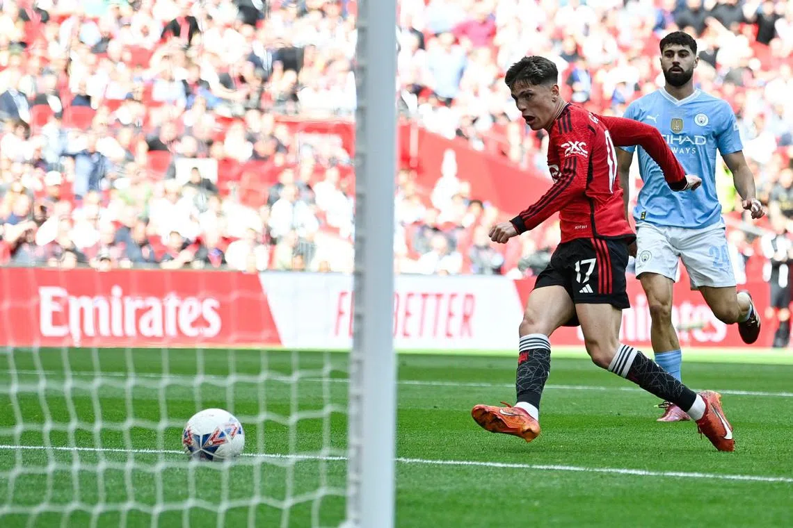 Manchester United's Alejandro Garnacho scoring his team's first goal in the FA Cup final against Manchester City.