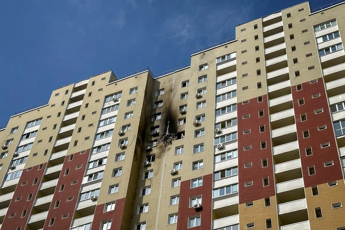 A view shows an apartment building hit by a Russian drone strike, amid Russia's attack on Ukraine, in Kyiv, Ukraine March 23, 2025. REUTERS/Manuel Ausloos