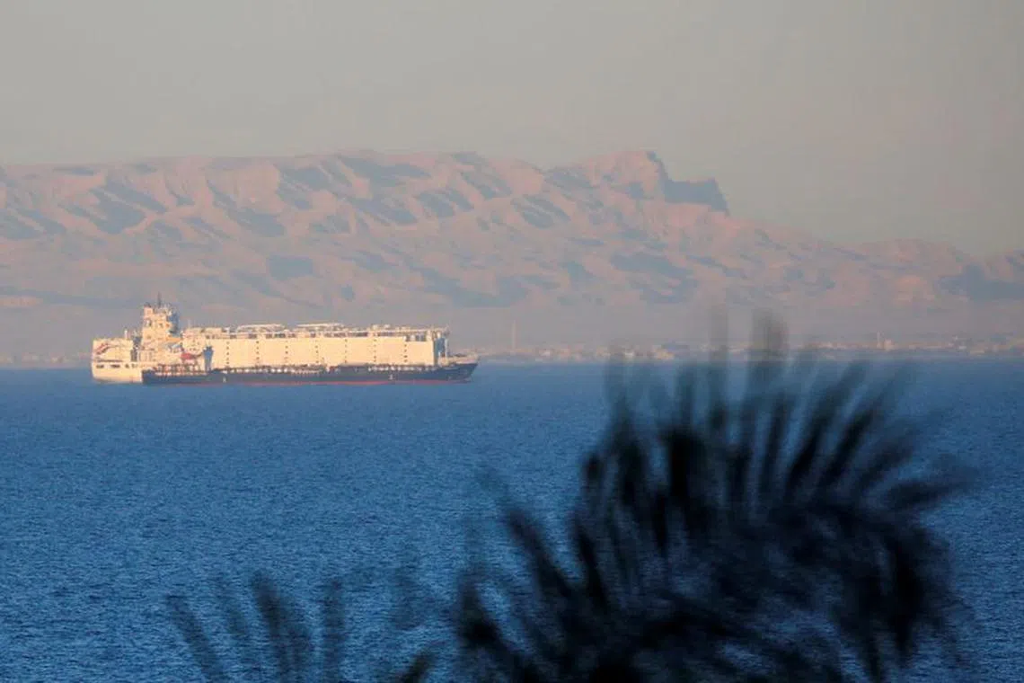 FILE PHOTO: Container ships sail across the Gulf of Suez towards the Red Sea before entering the Suez Canal, in El Ain El Sokhna in Suez, east of Cairo, Egypt, March 17, 2018. Picture taken March 17, 2018. REUTERS/Amr Abdallah Dalsh/File Photo