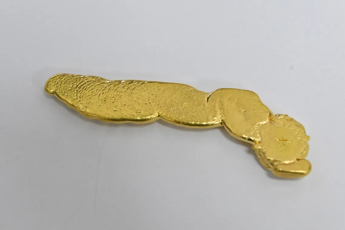 The woman was trying to dispose of nearly 1kg of melted gold pieces at the time of her arrest.