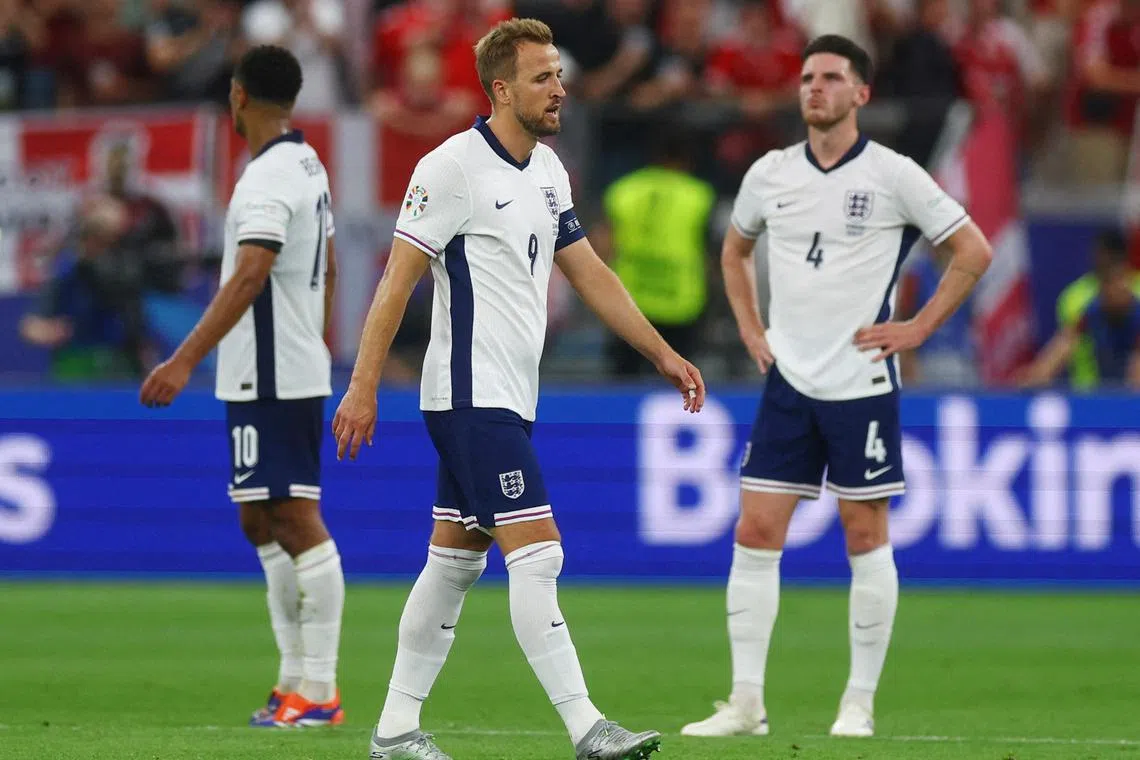 England's Harry Kane (centre) and Declan Rice look dejected after Morten Hjulmand scores the equaliser for Denmark.