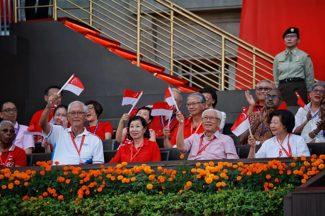 (L-R) Mr and Mrs Goh Chok Tong, and Dr Tony Tan and his wife Mary, during National Day Parade at the Padang on Aug 9, 2023. ST PHOTO: KEVIN LIM