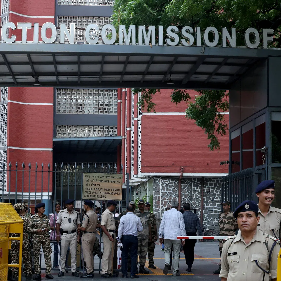 FILE PHOTO: Members of security forces stand guard at the entrance of Election Commission of India headquarters on the day of a protest by the supporters of India’s main opposition Congress party demanding the resignation of Chief Election Commissioner Gyanesh Kumar, in New Delhi, India, September 25, 2026. REUTERS/Bhawika Chhabra/File Photo