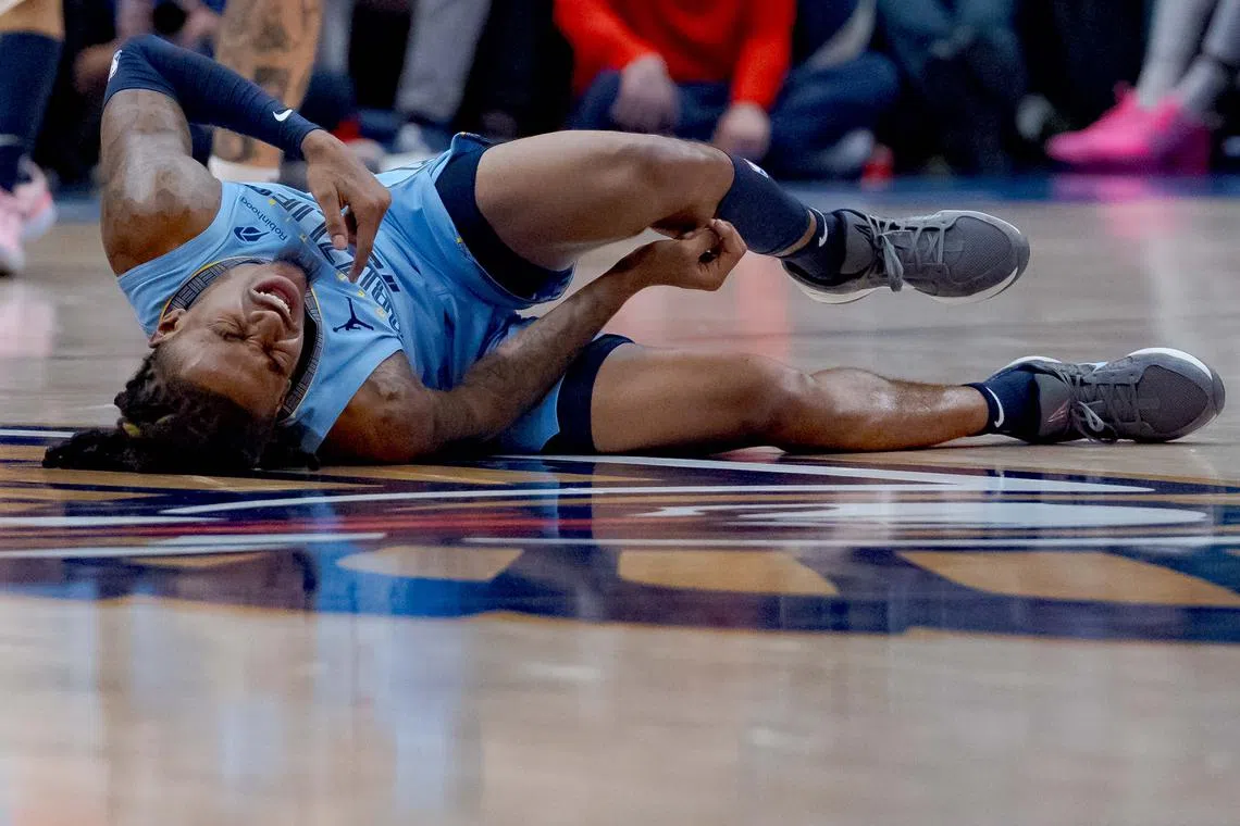 Dec 27, 2024; New Orleans, Louisiana, USA; Memphis Grizzlies guard Ja Morant (12) reacts after a screen by New Orleans Pelicans center Daniel Theis (10) during the third quarter at Smoothie King Center. Mandatory Credit: Matthew Hinton-Imagn Images/ File Photo