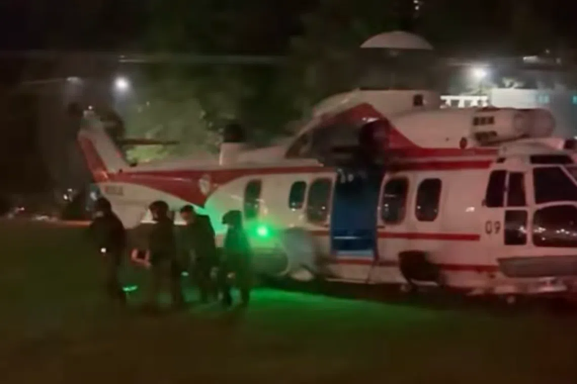 Emergency medical staff attend to a patient conveyed to hospital by the RSAF’s Rescue 10 unit.