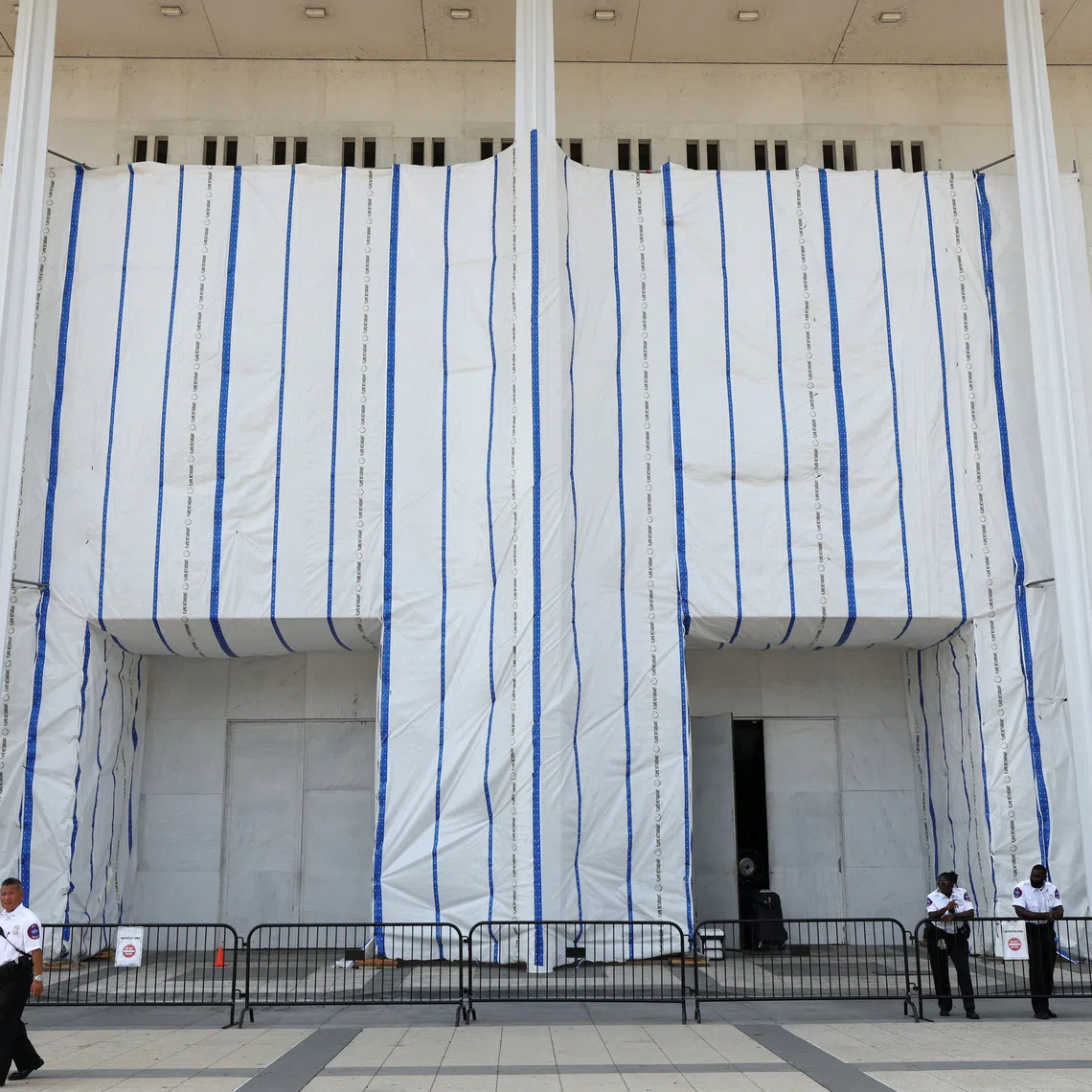 Security keeps watch at the main entrance to the John F. Kennedy Center for the Performing Arts as the centre’s board voted to inscribe onto the building “Restored and Renovated by President Donald J. Trump”, in Washington DC, on Aug 13.