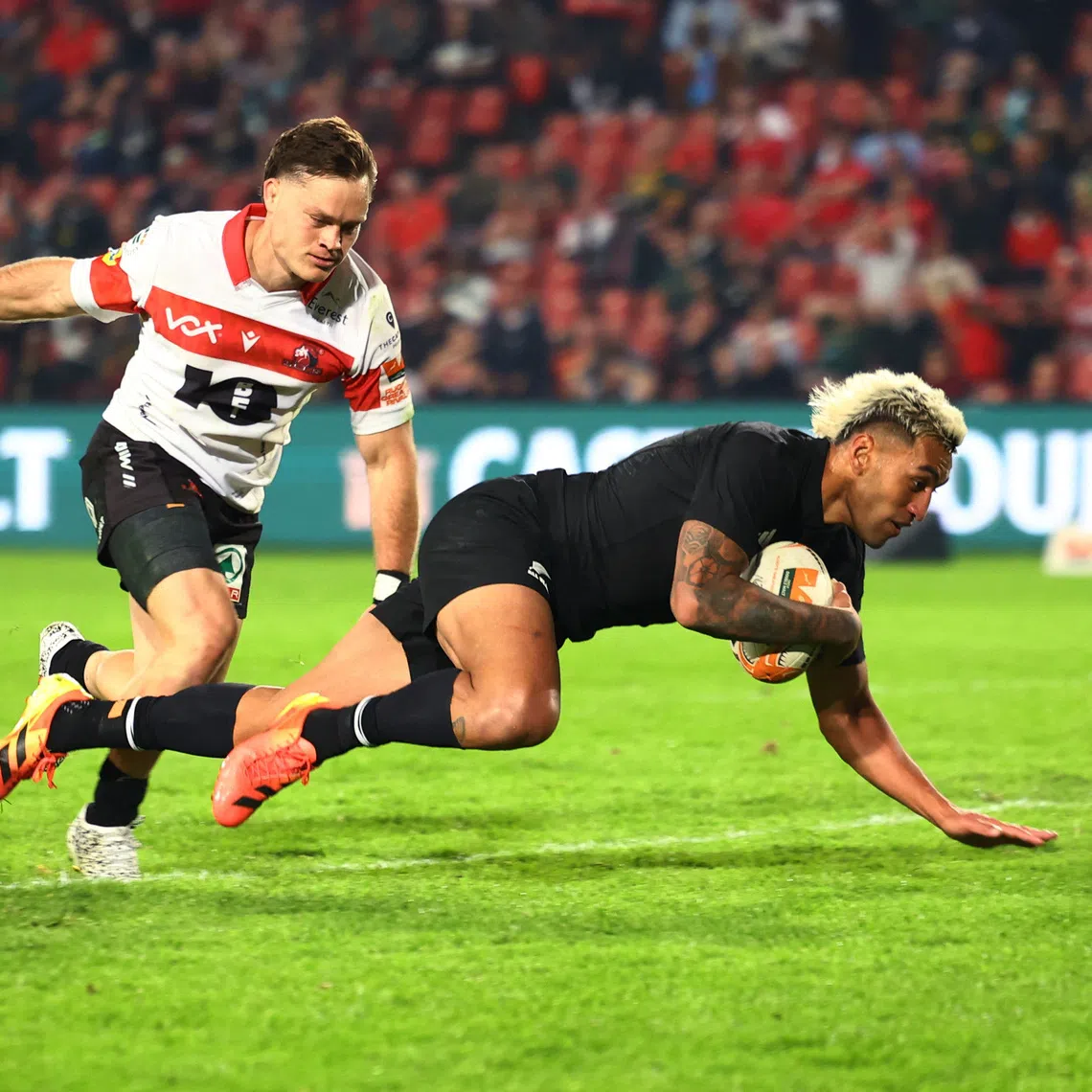 New Zealand’s Rieko Ioane scoring their fifth try against the Lions at Ellis Park Stadium in Johannesburg on Aug 25. The All Blacks won 41-35.