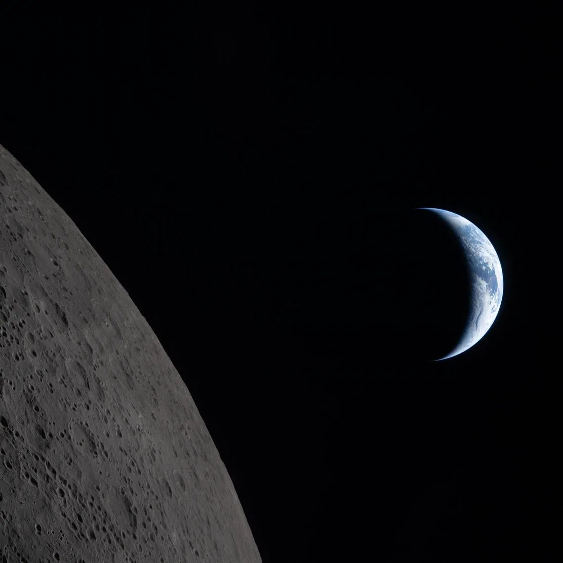 A photo from NASA shows the Earth closer to passing behind the Moon in this image captured by the Artemis II crew.