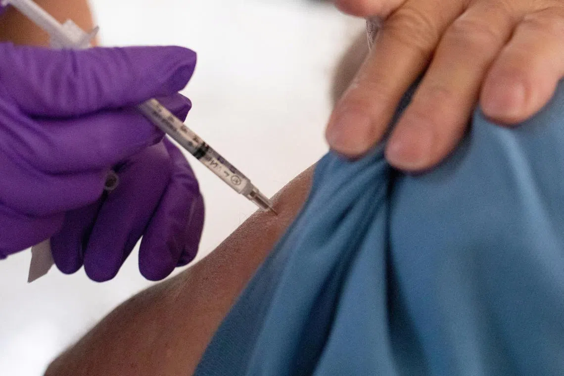 FILE PHOTO: A 50-year-old and immunocompromised resident receives a second booster shot of the coronavirus disease (COVID-19) vaccine in Waterford, Michigan, U.S., April 8, 2022.  REUTERS/Emily Elconin/File Photo