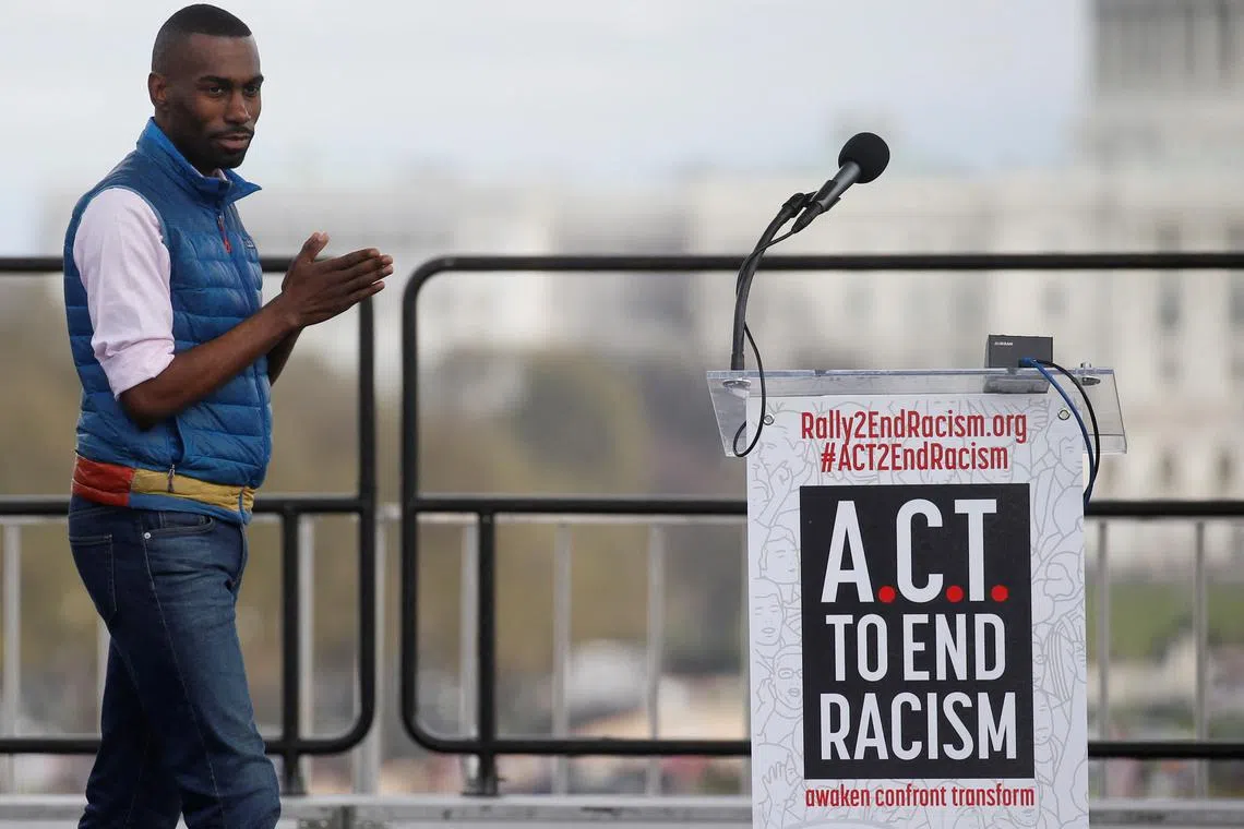 FILE PHOTO: Civil rights activist DeRay Mckesson walks to the lectern to speak during the \"End Racism Rally\" on the 50th anniversary of the assassination of civil rights leader Rev. Martin Luther King Jr. on the National Mall in Washington, U.S., April 4, 2018. REUTERS/Leah Millis/File Photo