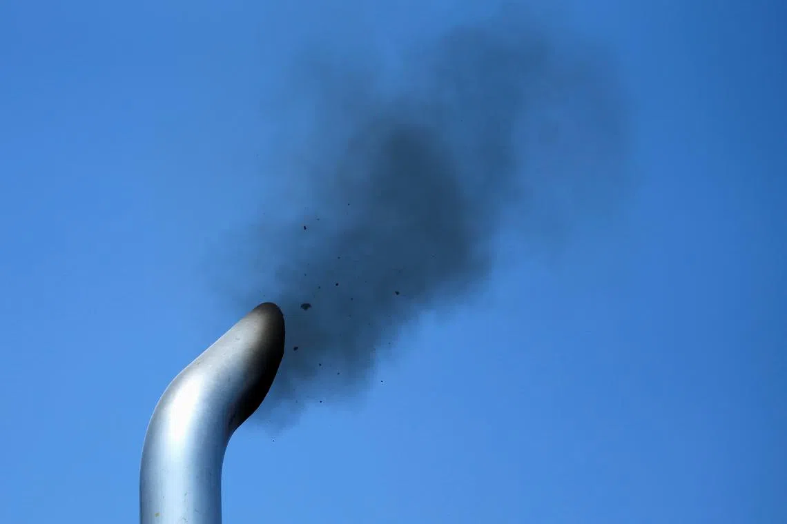 FILE PHOTO: A truck engine is tested for pollution exiting its exhaust pipe as California Air Resources field representatives (unseen) work a checkpoint set up to inspect heavy-duty trucks traveling near the Mexican-U.S. border in Otay Mesa, California September 10, 2013. REUTERS/Mike Blake/File Photo