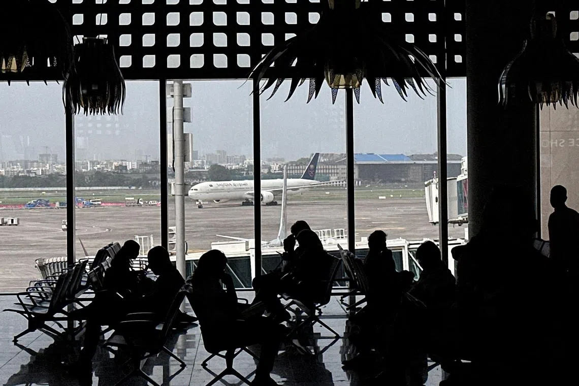 People wait to board their flight at the Chhatrapati Shivaji Maharaj International Airport in Mumbai, India, on May 30, 2025. 