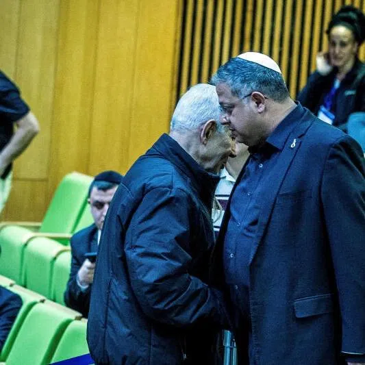 Israeli Prime Minister Benjamin Netanyahu and Israel’s far-right National Security Minister Itamar Ben-Gvir shake hands as they attend a session at the Knesset, Israeli Parliament, in Jerusalem.