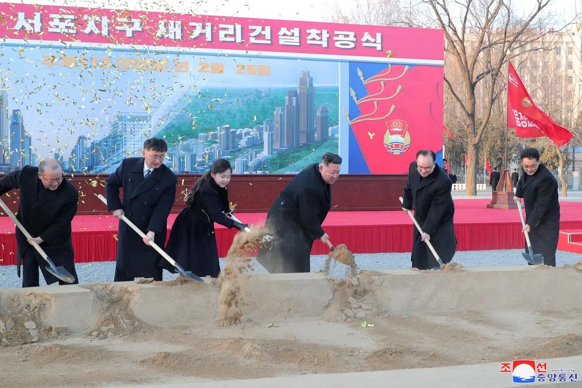 North Korean leader Kim Jong Un and his daughter Kim Ju Ae attend a ceremony for the construction of a new street, in Sopho District, Pyongyang, in this undated photo released on Feb 26. 