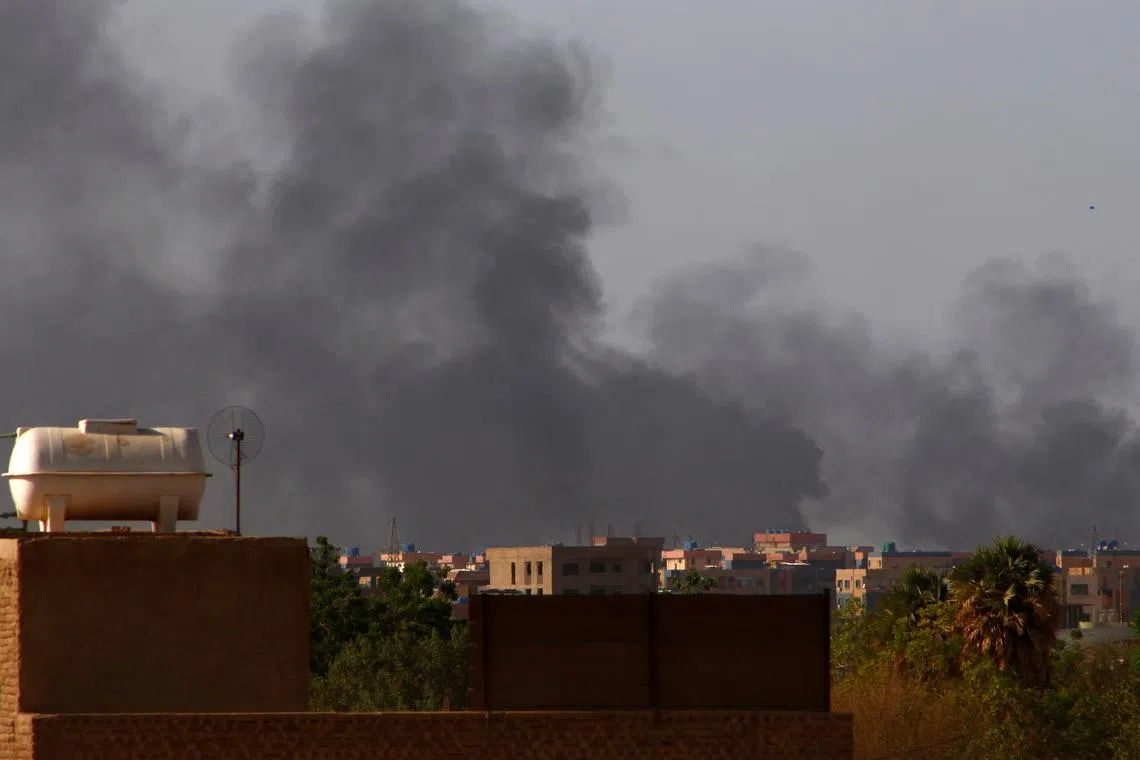 Smoke billows in the distance in Khartoum on May 22, 2023, as fighting between two rival generals persists.