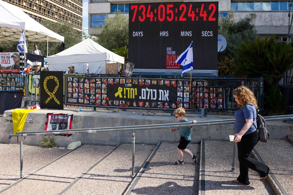 Posters of hostages held by Hamas in Gaza, at Hostages Square in Tel Aviv on Oct 10.