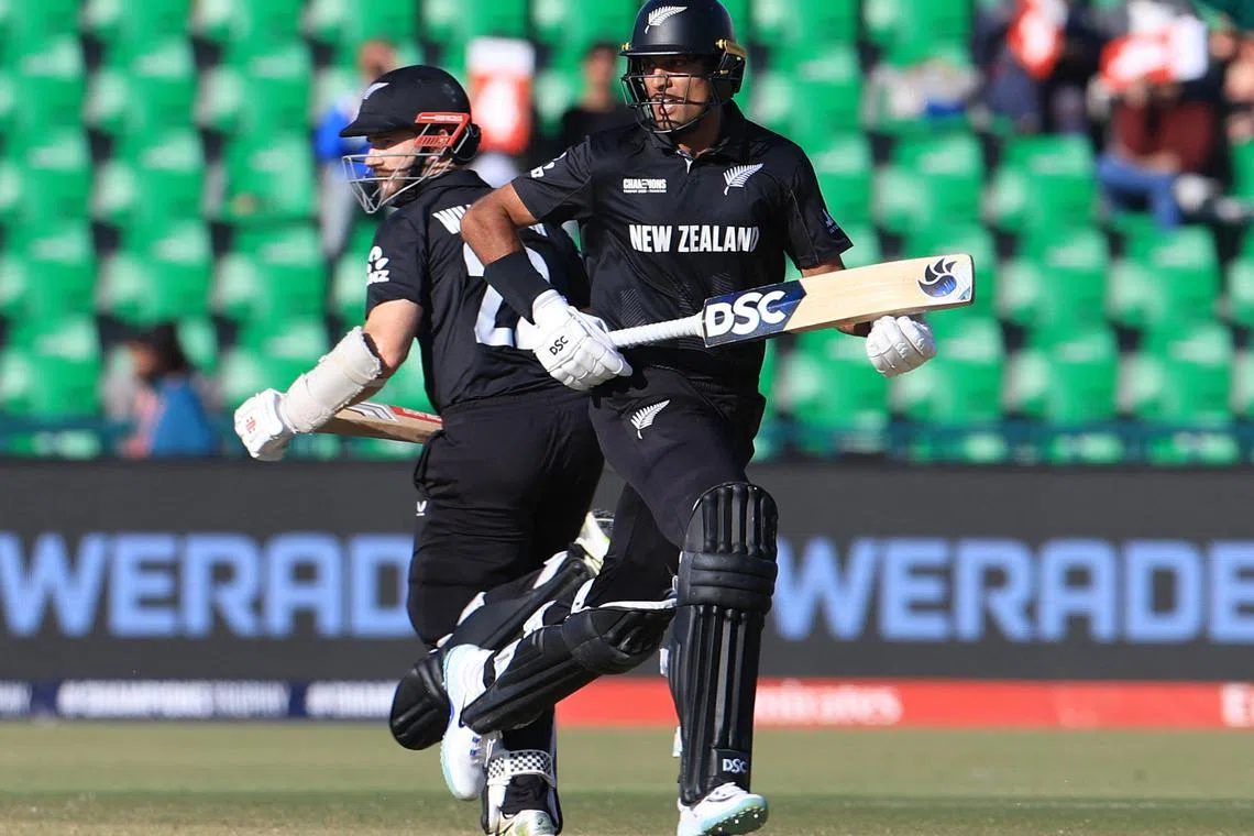 FILE PHOTO: Cricket - ICC Men's Champions Trophy - Semi Final - South Africa v New Zealand - Gaddafi Stadium, Lahore, Pakistan - March 5, 2025 New Zealand's Rachin Ravindra in action with Kane Williamson REUTERS/Akhtar Soomro/File Photo