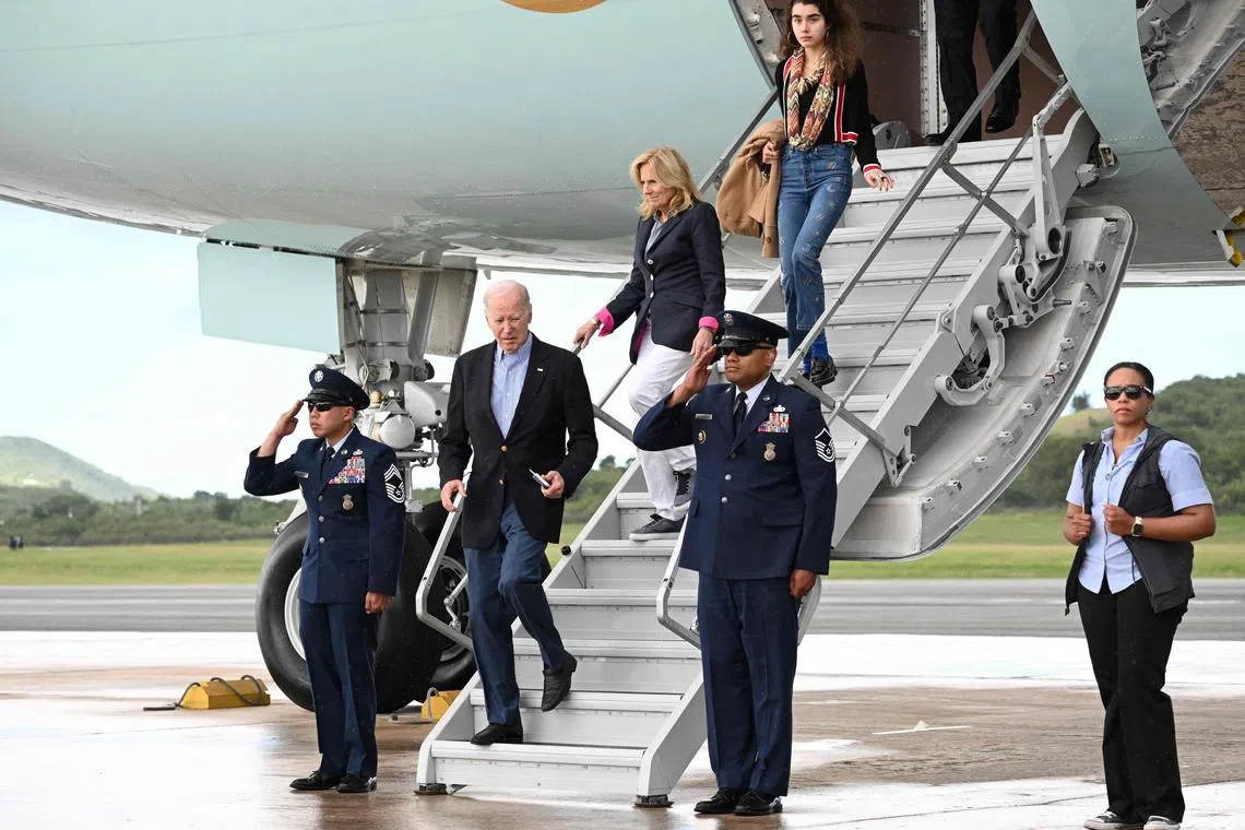 US President Joe Biden, First Lady Jill Biden and their granddaughter Natalie step off Air Force One upon arrival in Saint Croix, in the US Virgin Islands.