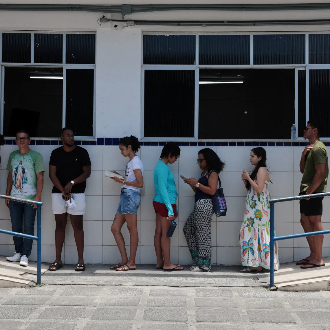 People wait in line to vote during Brazil's general election, in Salvador, Brazil, October 4, 2026. REUTERS/Antonello Veneri