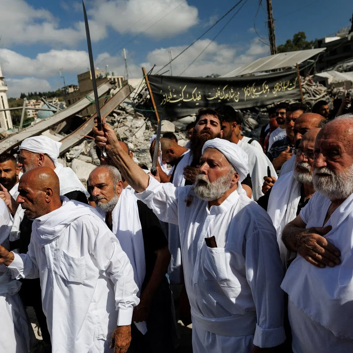 Shi’ite Muslim mourners participate in Ashura commemorations, marking the holiest day in the Shi’ite calendar, in Nabatieh, southern Lebanon on June 26.