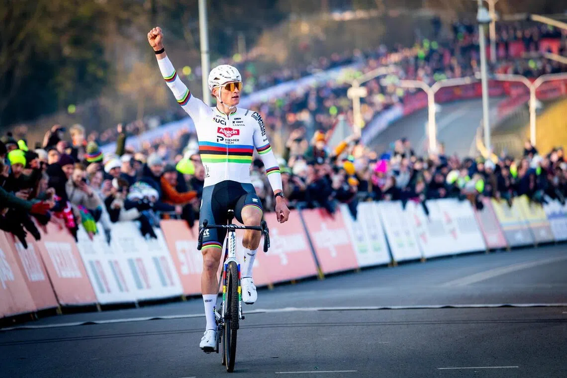 Mathieu van der Poel of the Netherlands celebrates his victory in the men elite race of the UCI Cyclo-cross World Cup in Hoogerheide, Netherlands, on Jan 25.