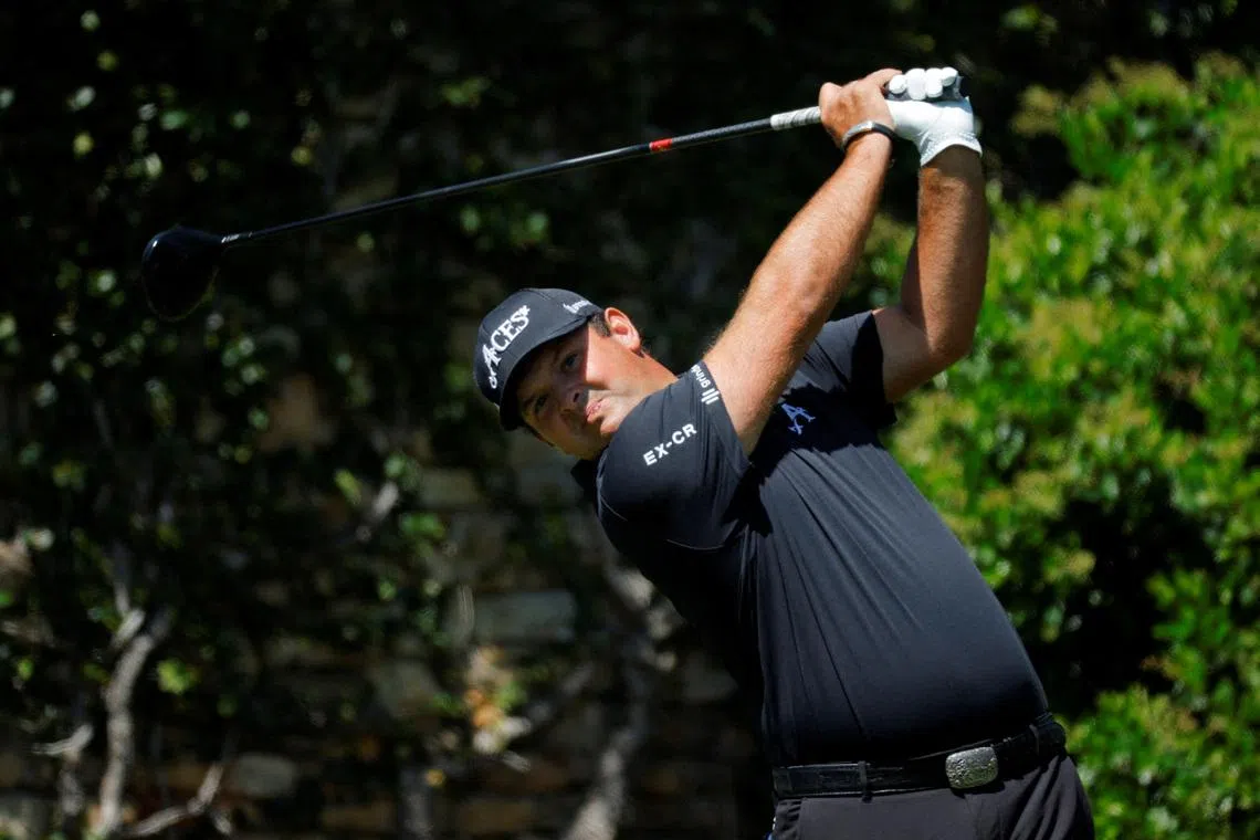 FILE PHOTO: Golf - The Masters - Augusta National Golf Club, Augusta, Georgia, U.S. - April 13, 2025 Patrick Reed of the U.S. hits his tee shot on the 2nd hole during the final round REUTERS/Mike Blake/File Photo
