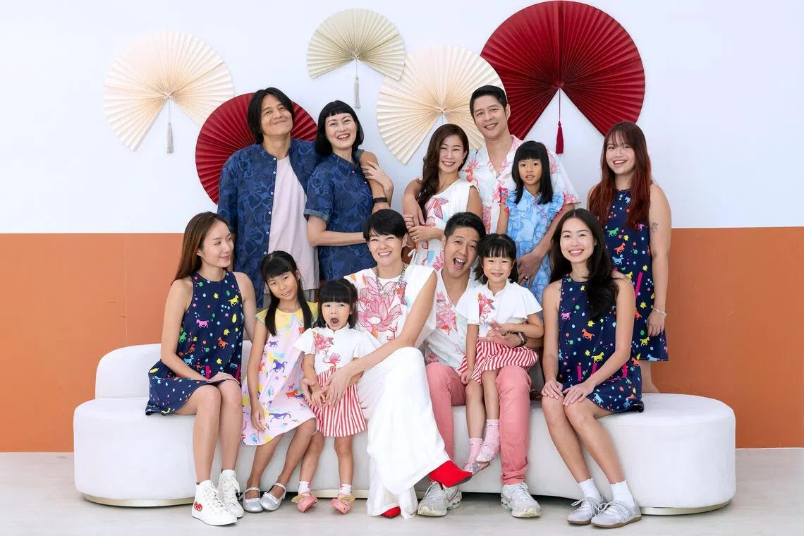 Sheila Sim with her family and friends in matching outfits that she designed in partnership with Le Petit Society.