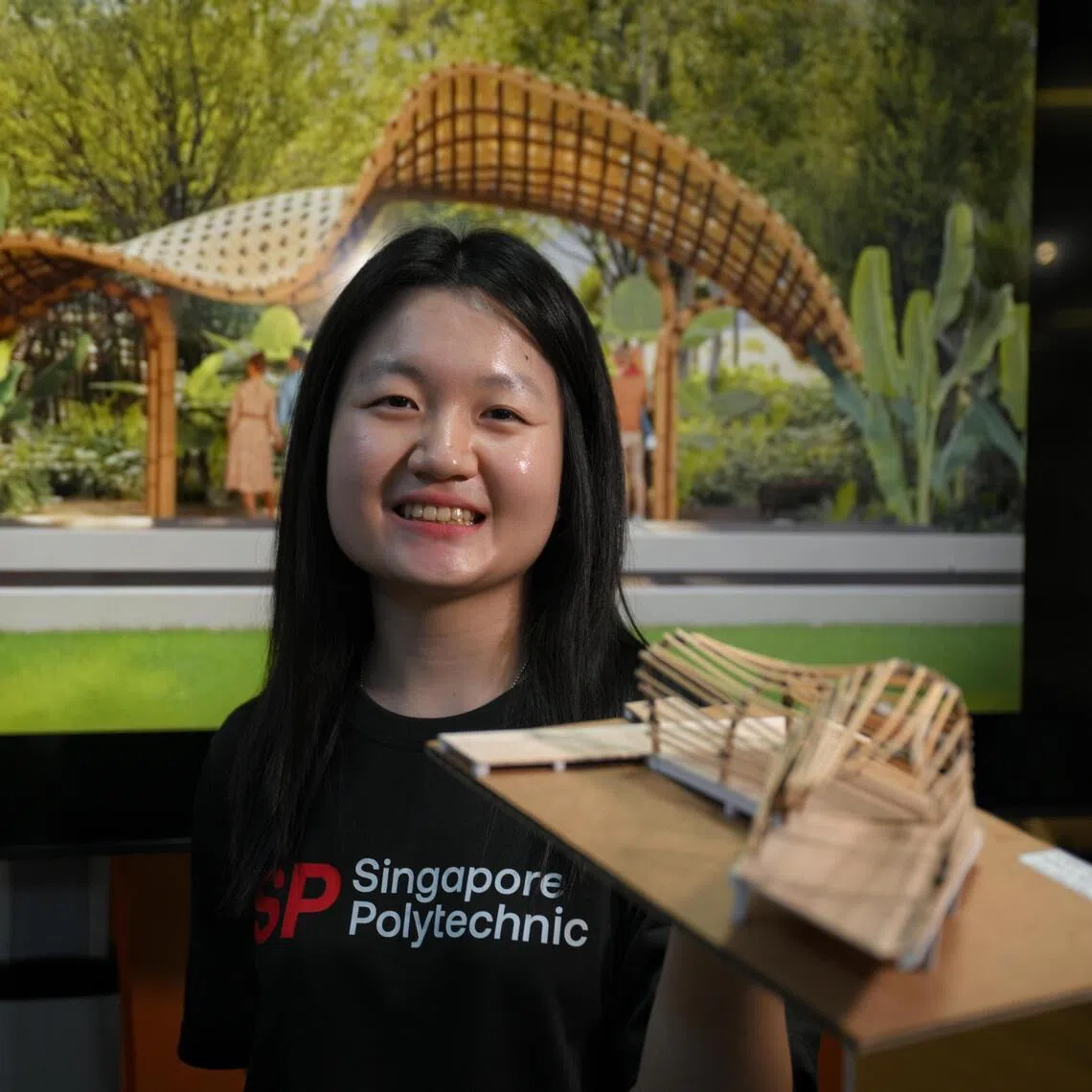 Singapore Polytechnic student Then Jing Ying, 22, with a model of her project called Peek-a-bill, which Translates the hornbill's habitat needs into immersive human experiences, on March 12, 2026.