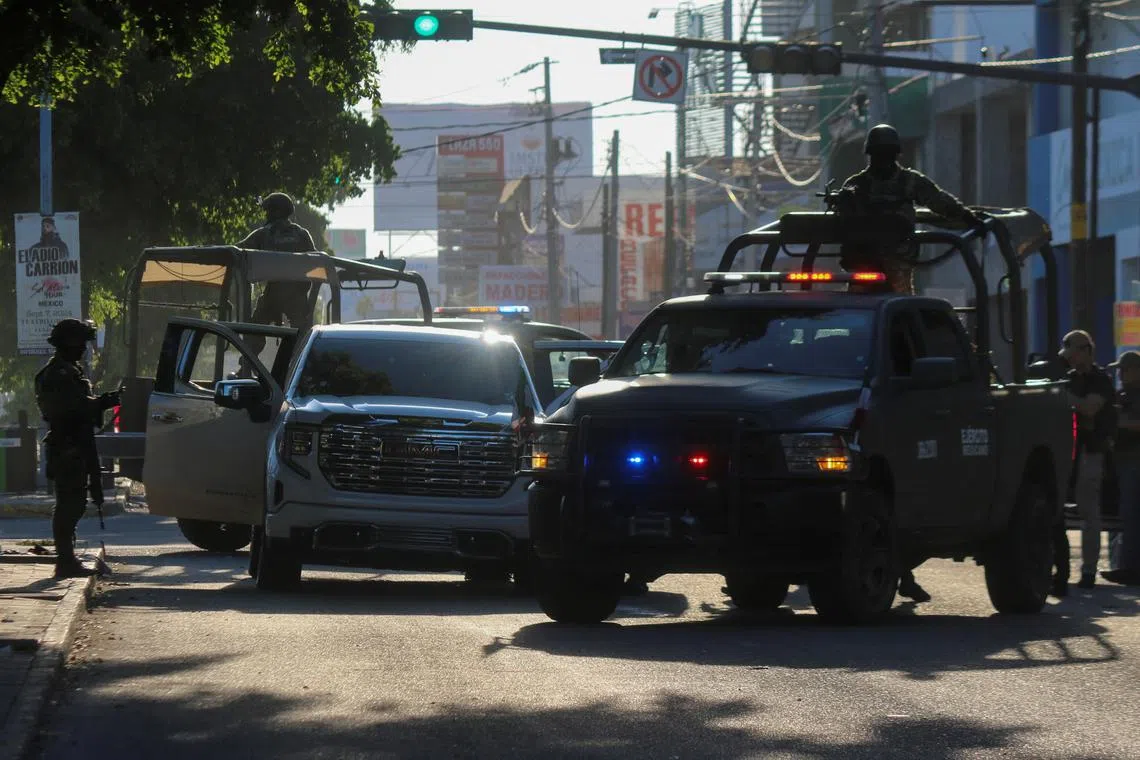 Members of the Mexican Army respond at the scene of a damaged automobile after a confrontation between armed groups, in Culiacan, Mexico September 9, 2024. REUTERS/Jesus Bustamante/File Photo