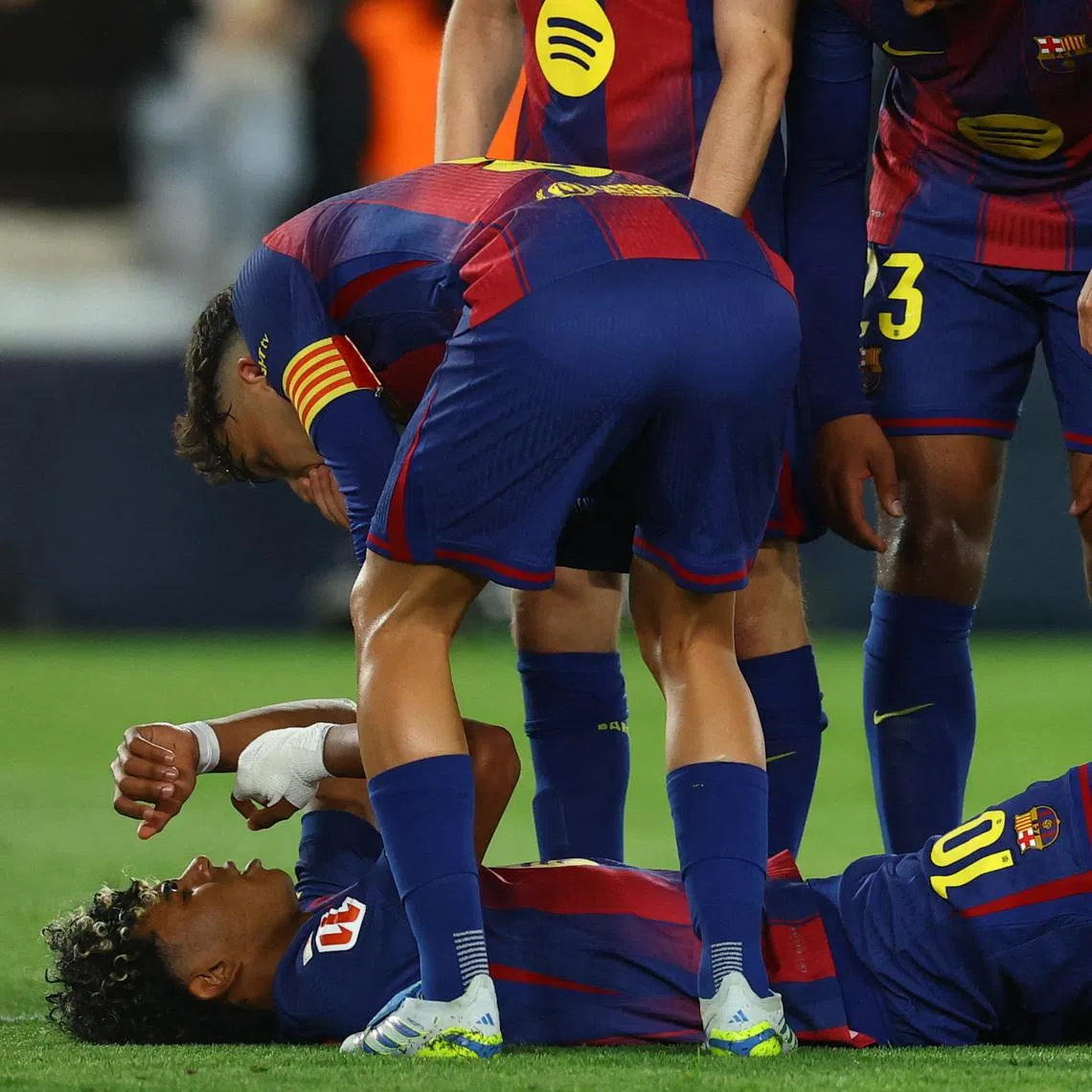 Soccer Football - LaLiga - FC Barcelona v Celta Vigo - Spotify Camp Nou, Barcelona, Spain - April 22, 2026 FC Barcelona's Lamine Yamal reacts after sustaining an injury REUTERS/Albert Gea