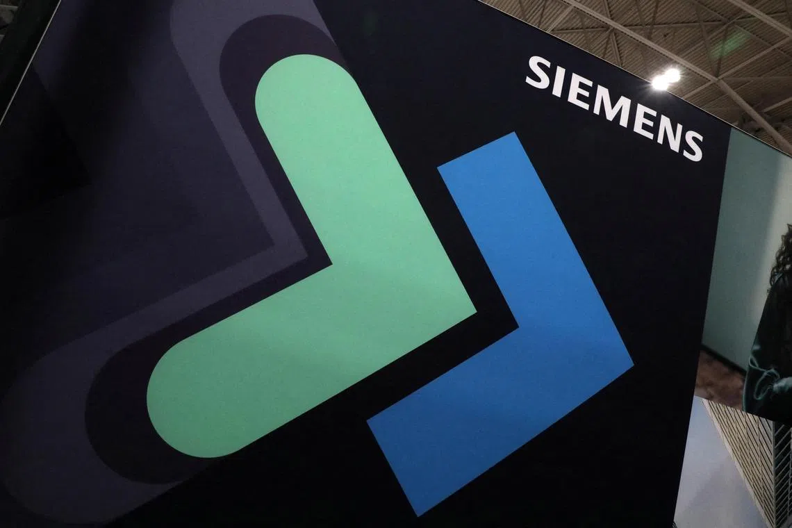 FILE PHOTO: The logo of German multinational conglomerate corporation Siemens AG is displayed at the Collision conference in Toronto, Ontario, Canada June 23, 2022. Picture taken June 23, 2022. REUTERS/Chris Helgren/File Photo
