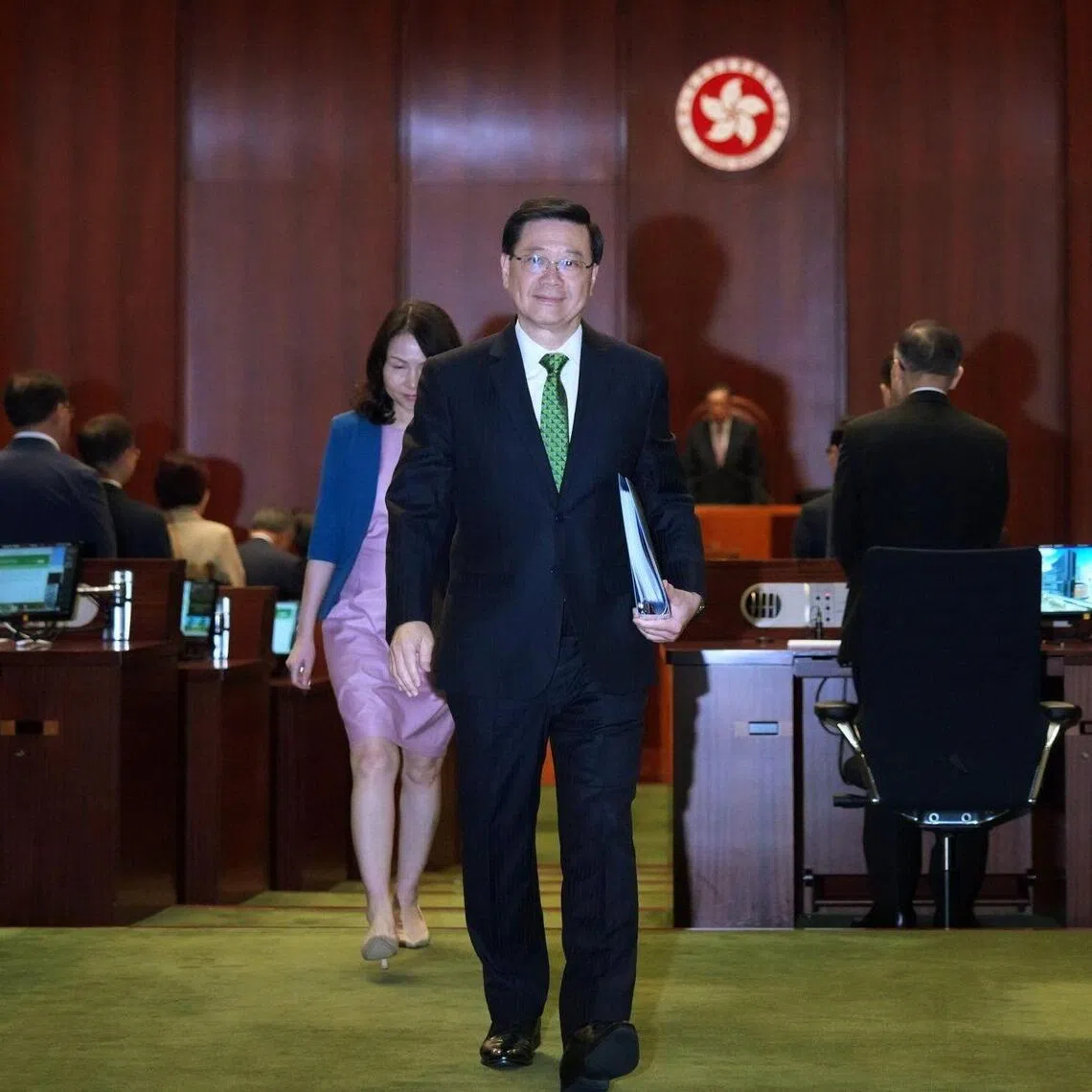 John Lee, Hong Kong's chief executive, leaves after delivering his policy address at the Legislative Council in Hong Kong, China, on Wednesday, Sept. 17, 2025. Lee said the city will accelerate the development of a cross-border tech hub with China as the Asian financial center searches for new growth drivers. Photographer: Lam Yik/Bloomberg