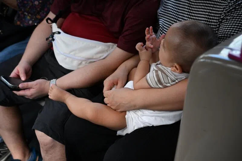 It is not easy to take care of parents and raise one’s own children at the same time, say the writers.