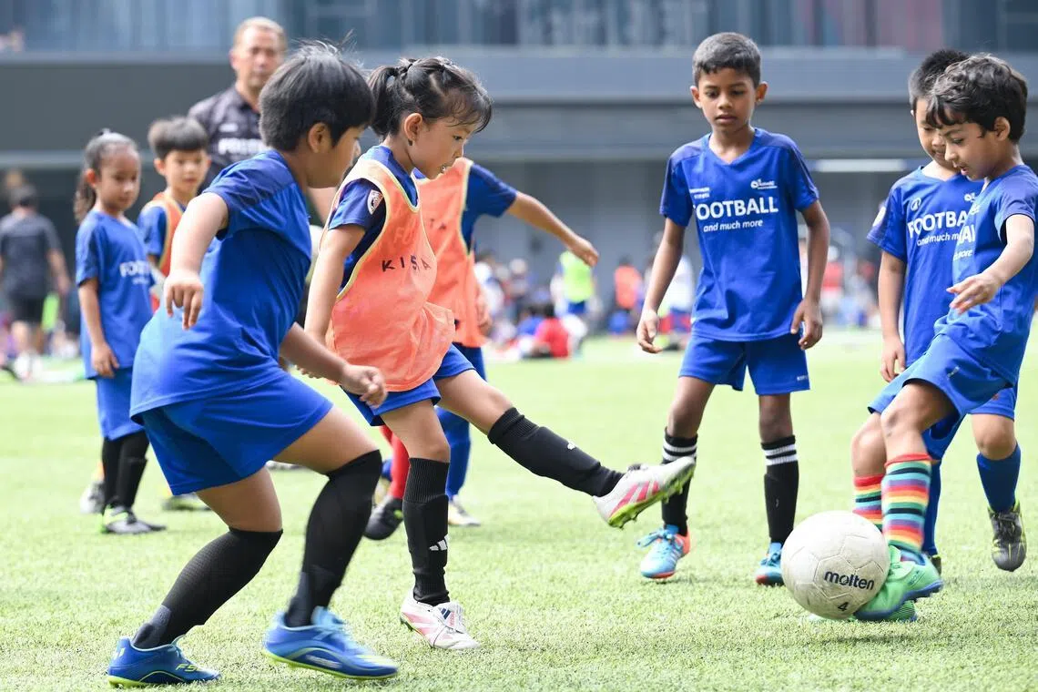 Misha Yap (second from left) taking part in an Under-8 mixed team match during the ActiveSG Football Academy (AFA) Football Fiesta at Our Tampines Hub on May 24.