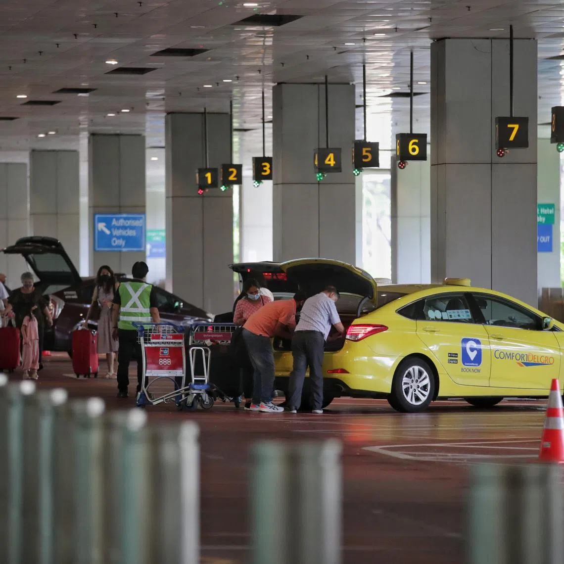 Passengers seen boarding taxis at Changi Airport Terminal 3 arrival hall on June 24, 2022 around 11.45am.