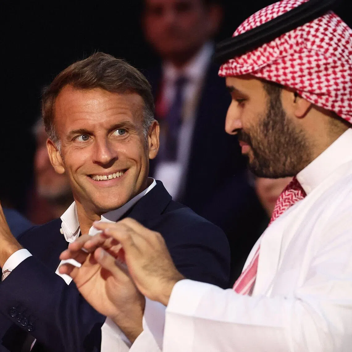 French President Emmanuel Macron (left) and the Crown Prince and Prime Minister of Saudi Arabia Mohammed bin Salman attend the closing ceremony of the Esports World Cup at the Grand Palais in Paris, France, on Aug 23.